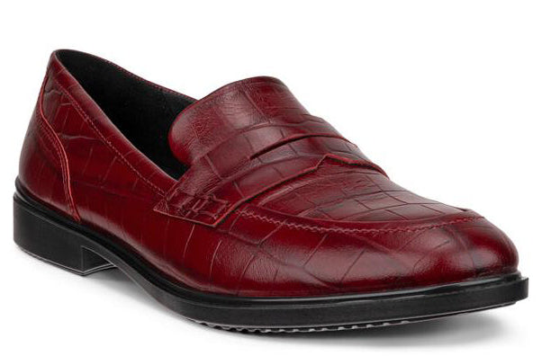 Reddish-brown crocodile-textured leather penny loafer with a black sole.