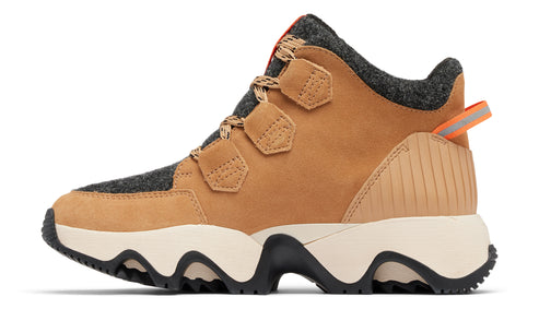 Side view of a tan leather ankle boot with a chunky white and black sole.