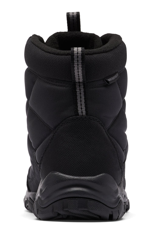 Rear view of a black quilted winter boot with a fabric pull loop.