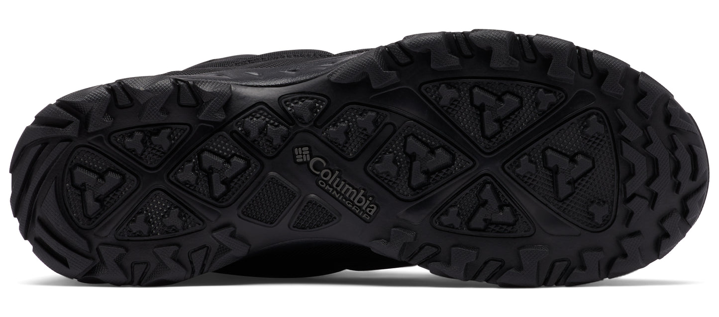 Black shoe sole with deep treads.