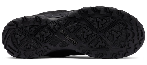 Black shoe sole with deep treads.