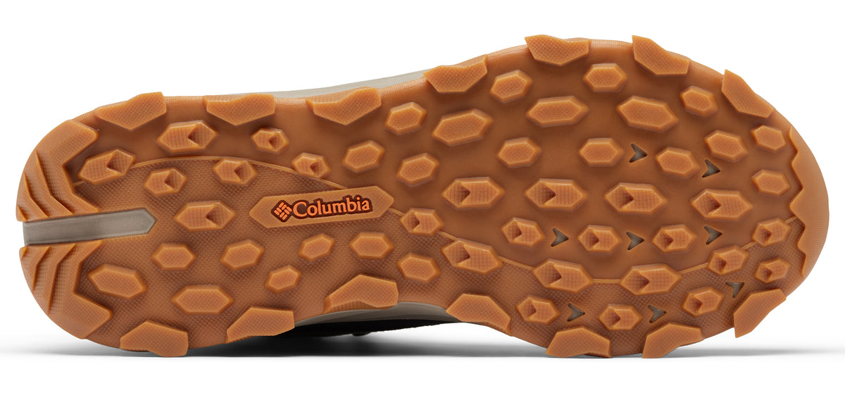 A shoe's brown rubber sole featuring the Columbia logo.