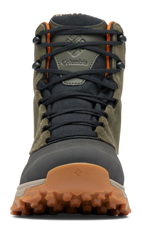 Olive and black boot with orange accents and a brown lug sole.