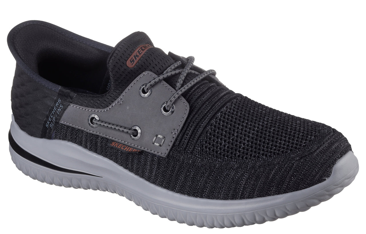 Dark gray slip-on boat shoe with decorative gray laces and gray sole.