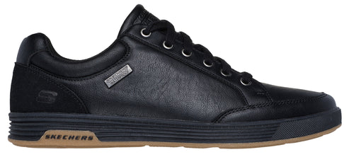 A black leather sneaker with black laces and a brown sole.