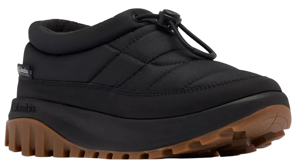 A black quilted slip-on shoe with a toggle drawstring closure, a thick black midsole, and a rugged brown treaded rubber outsole, with Columbia text branding visible on the heel.