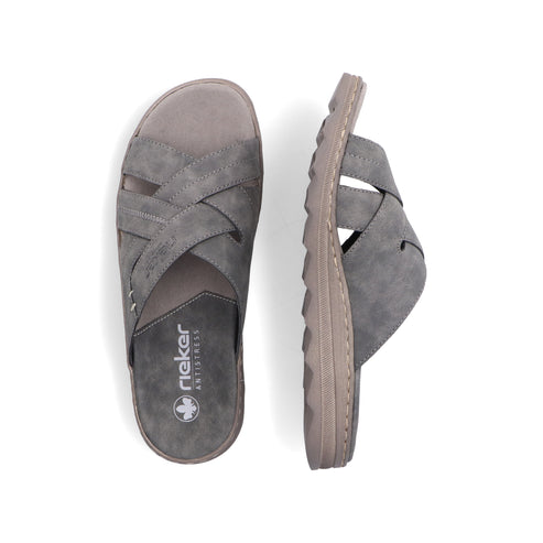Two gray slide sandals with crossing straps and visible "rieker ANTISTRESS" logo.
