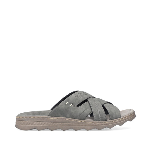 Gray sandal with criss-cross straps and a textured sole.