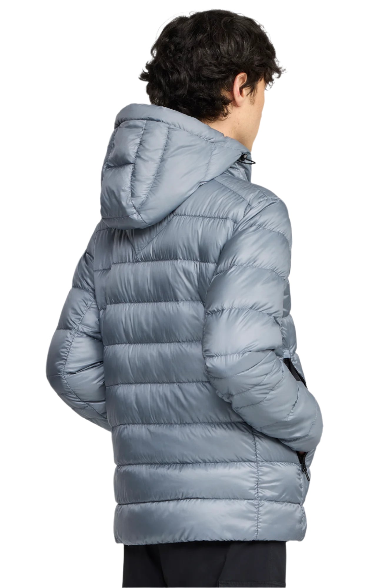 Back view of person wearing a shiny, light blue puffer jacket with a hood.