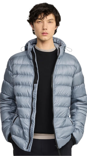 A man wearing a light blue puffer coat.