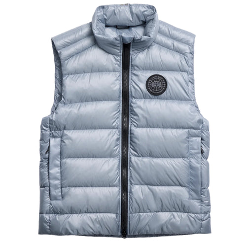 Sleeveless, quilted, silver vest with a full length black zipper.