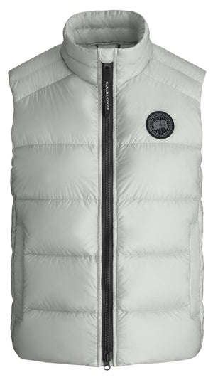 A white puffer vest with a black zipper and a circular logo on the right chest.