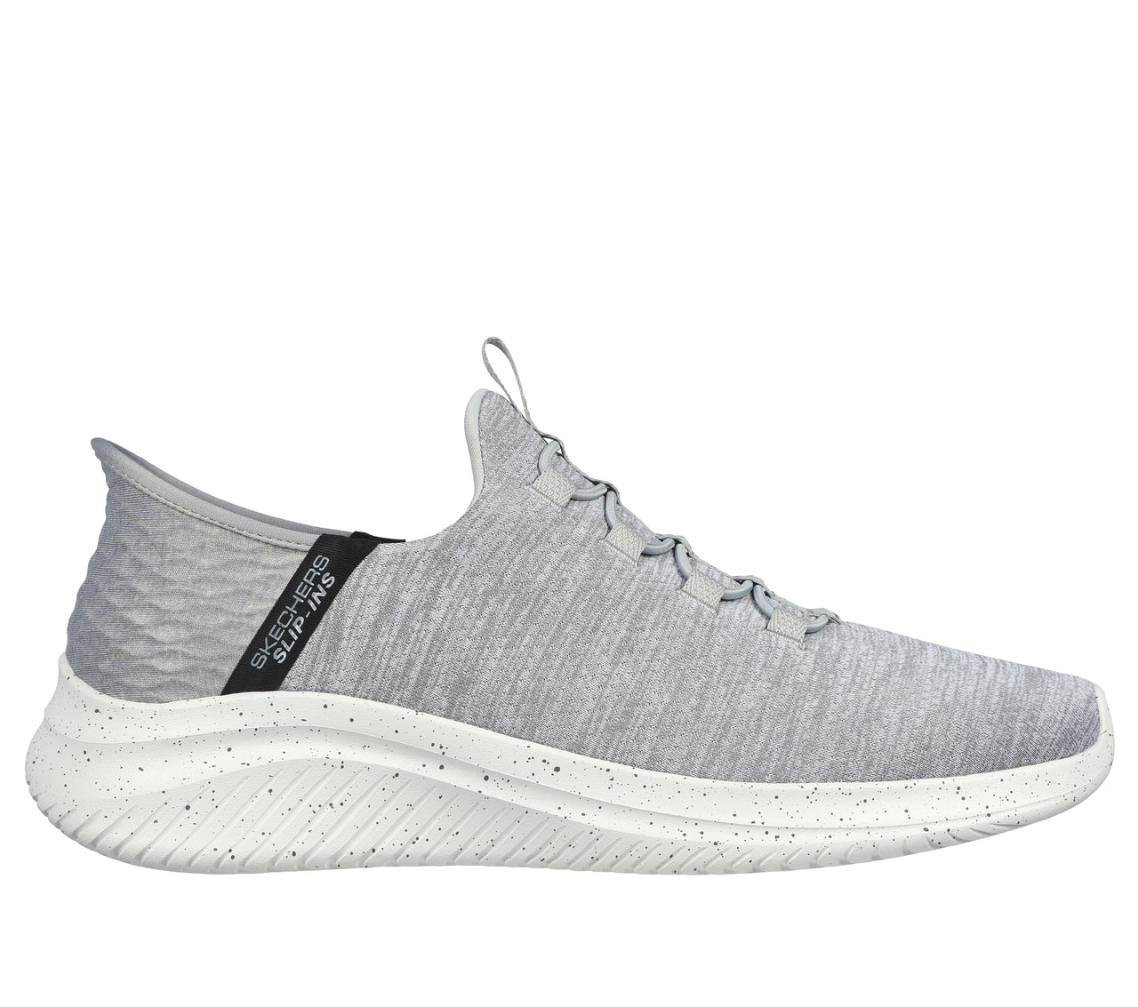 Slip-on light gray sneaker with a white sole and black accent on the back, showing a ribbed heel.