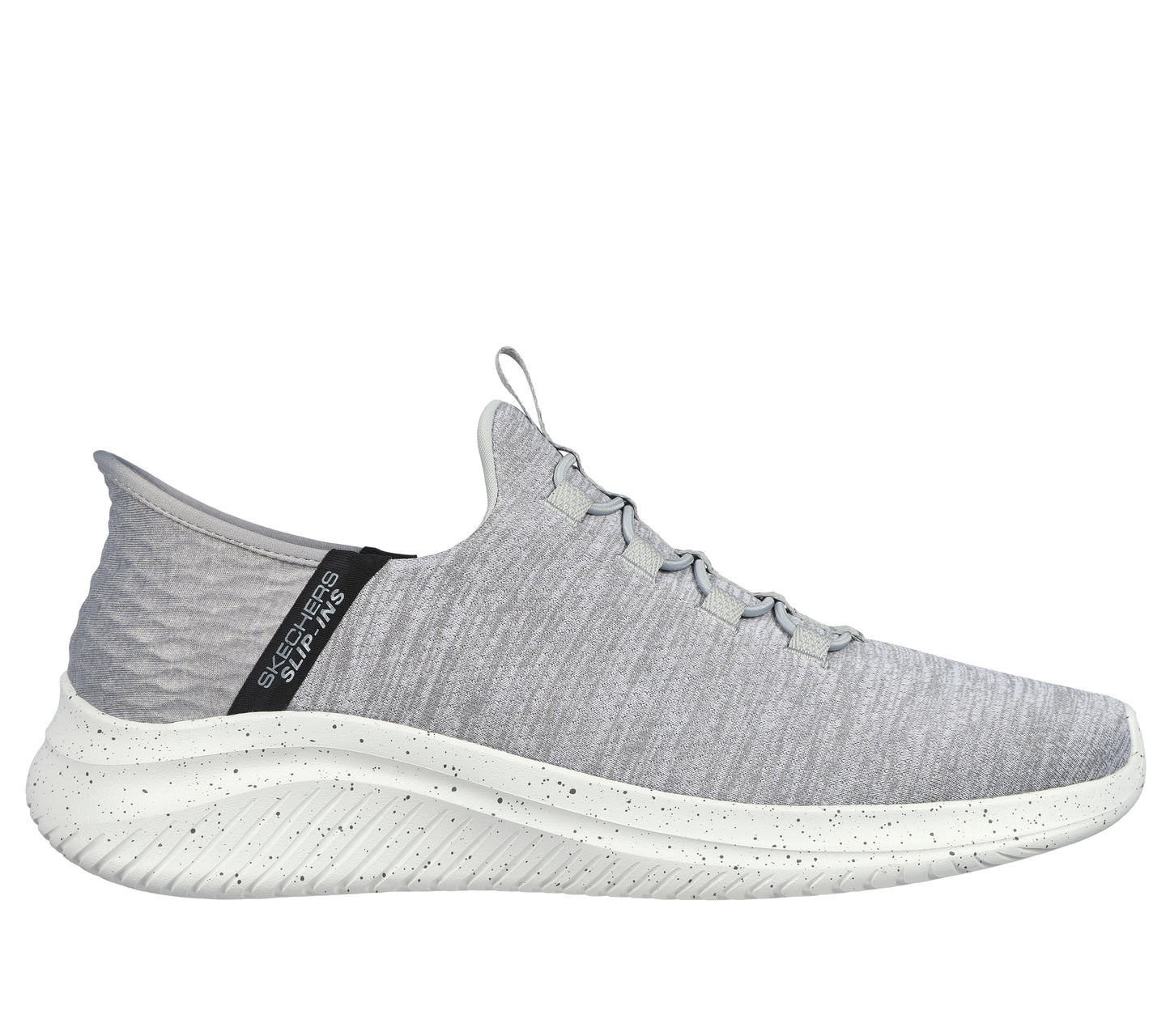 Slip-on light gray sneaker with a white sole and black accent on the back, showing a ribbed heel.