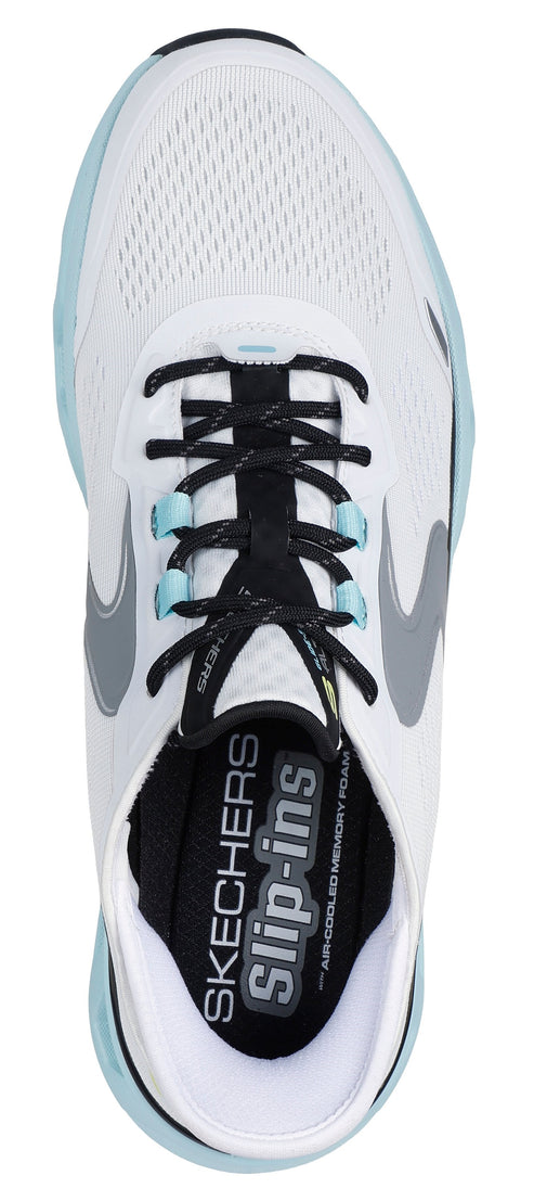 A white shoe with black laces and a gray logo on the side. The insole features "SKECHERS Slip-ins" branding.