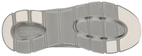 A shoe sole with a gray ribbed texture.