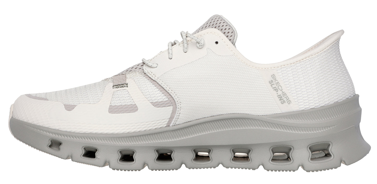 A white sneaker with a gray sole and laces.