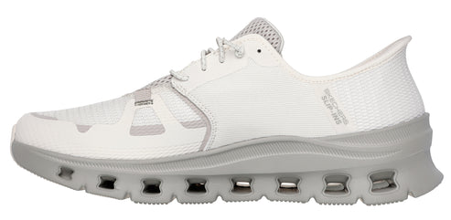 A white sneaker with a gray sole and laces.