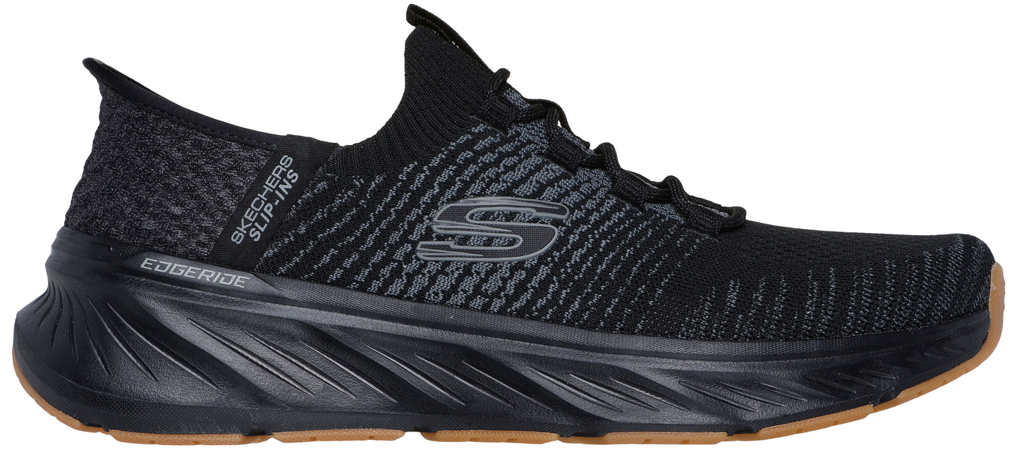 A black athletic shoe with EDGE RIDE and SKECHERS SLIP-INS text on the side.