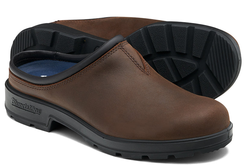 Brown leather clog with a black sole and trim.