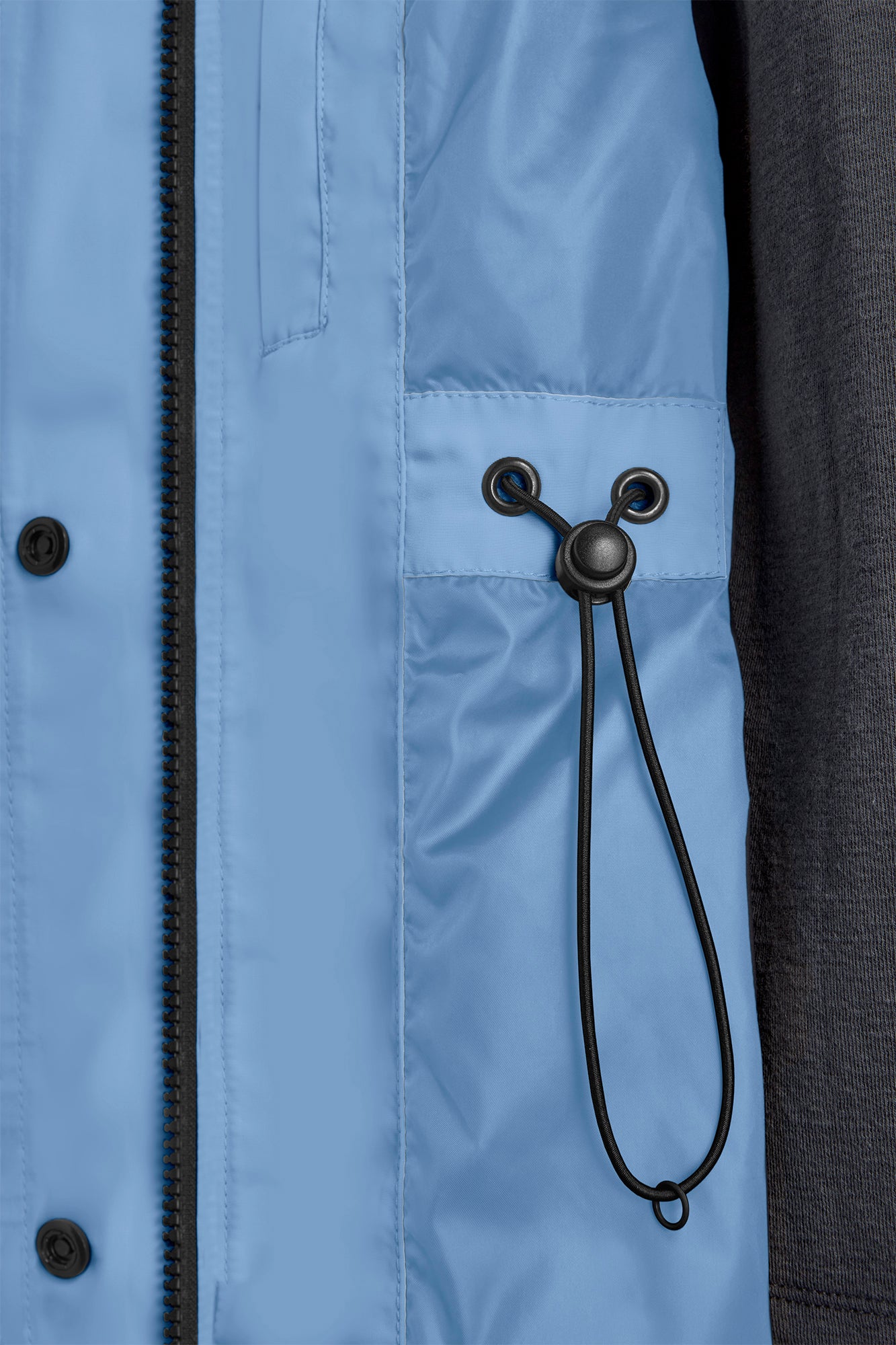 Close-up of light blue jacket lining with black drawstring, and button closure.