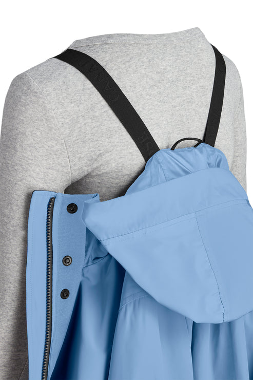 Light blue hooded rain jacket with black backpack straps.