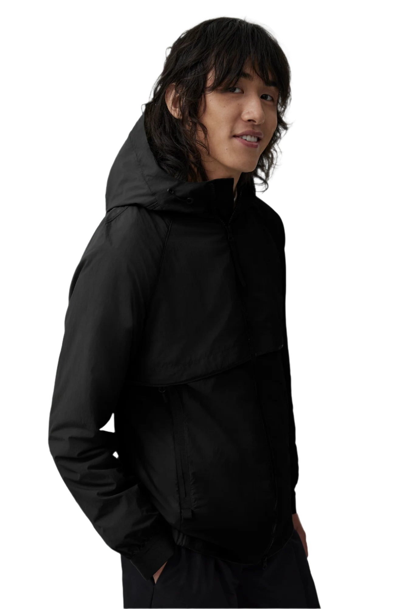 A person wearing a black hooded jacket.