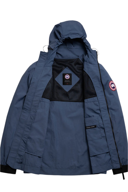 Open blue hooded jacket showing a black mesh interior with a logo patch, and a logo on the arm.