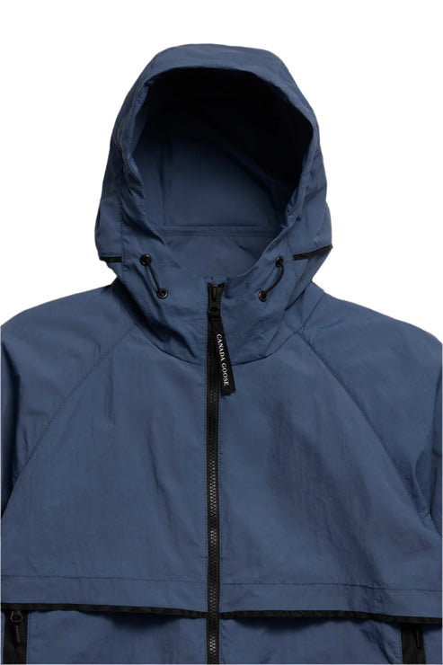 Blue hooded jacket with a zipper.