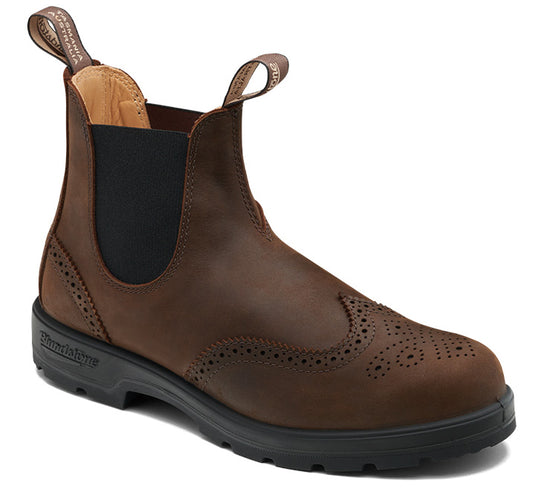 A brown leather ankle boot with black elastic side panels and a black sole.