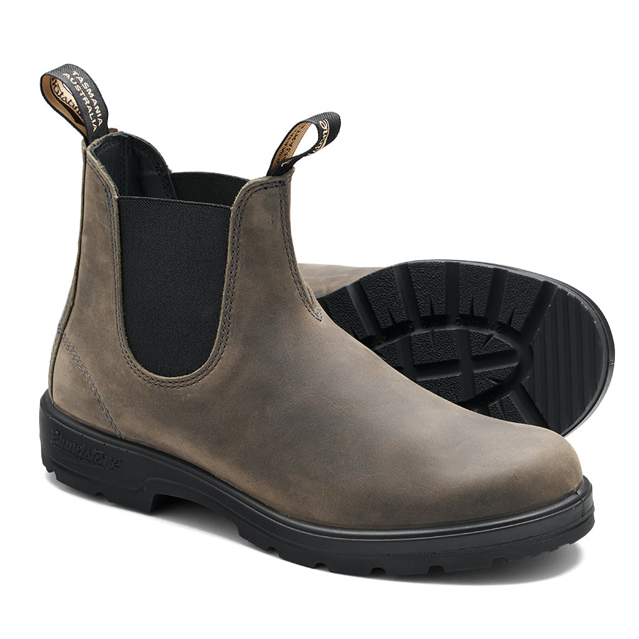 Pair of ankle-high boots, weathered gray leather, black elastic side panels, black lug soles, pull tabs.