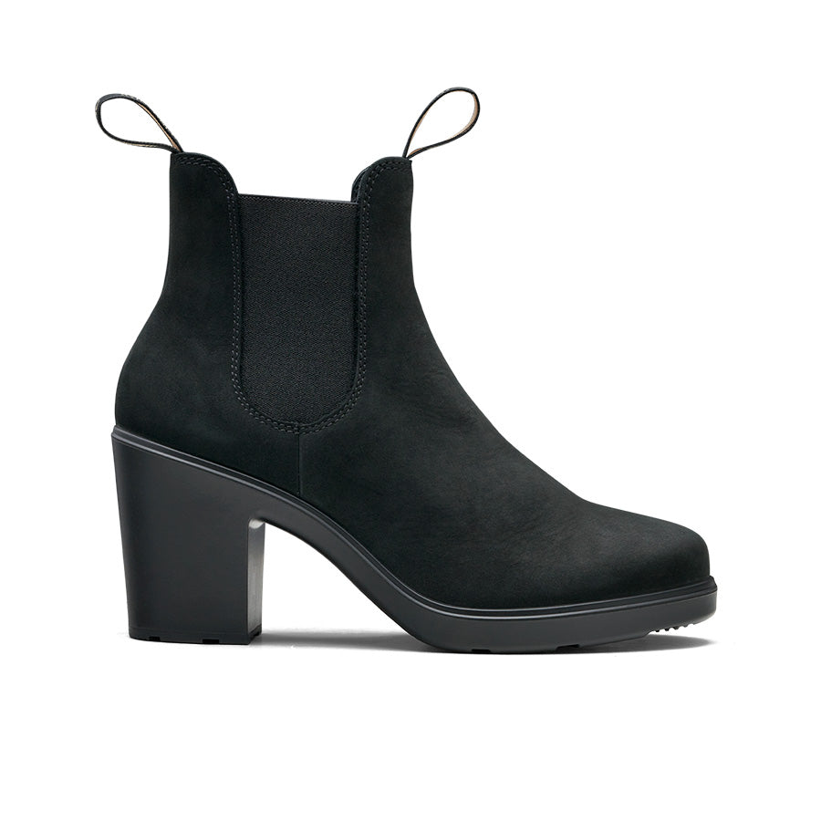 A black, matte, ankle-high boot with elastic side panels and block heels.