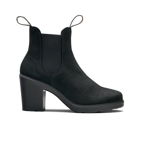 A black, matte, ankle-high boot with elastic side panels and block heels.