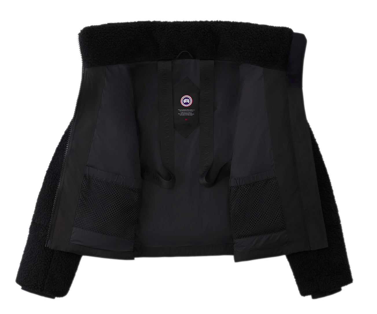Inside view of a black jacket with two mesh pockets. The brand's logo is visible on the inside.