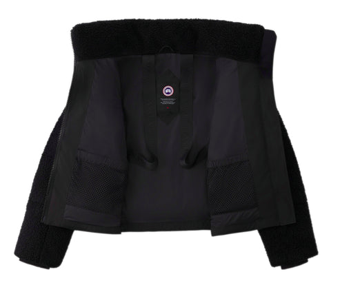 Inside view of a black jacket with two mesh pockets. The brand's logo is visible on the inside.