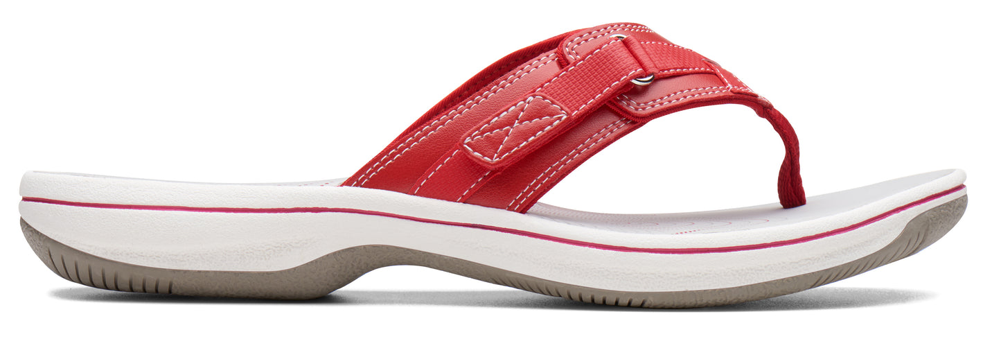 A red sandal with a white sole.