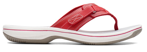 A red sandal with a white sole.