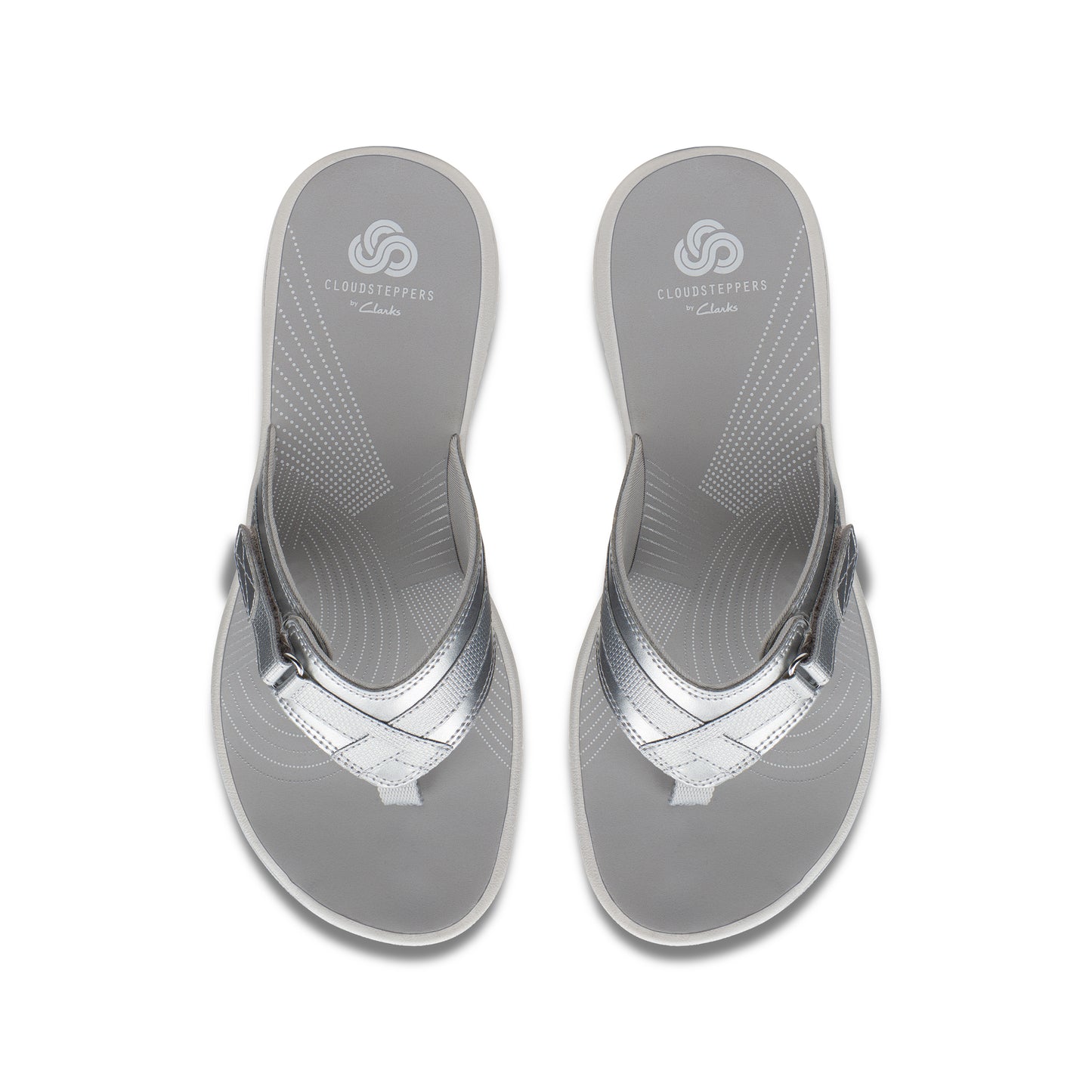 Two silver thong sandals with a silver strap and "Cloudsteppers by Clarks" printed on the insole.