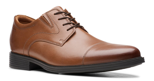 Tan leather cap-toe dress shoe with black laces and sole.