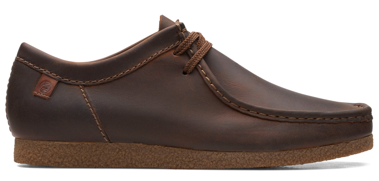 A brown leather moccasin-style shoe with a light brown sole.