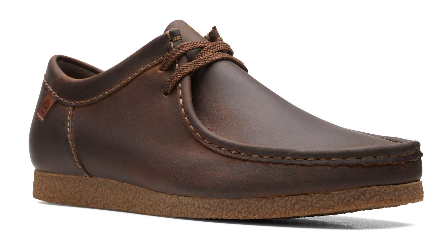 Low-rise, brown leather shoe with stitched toe and brown laces