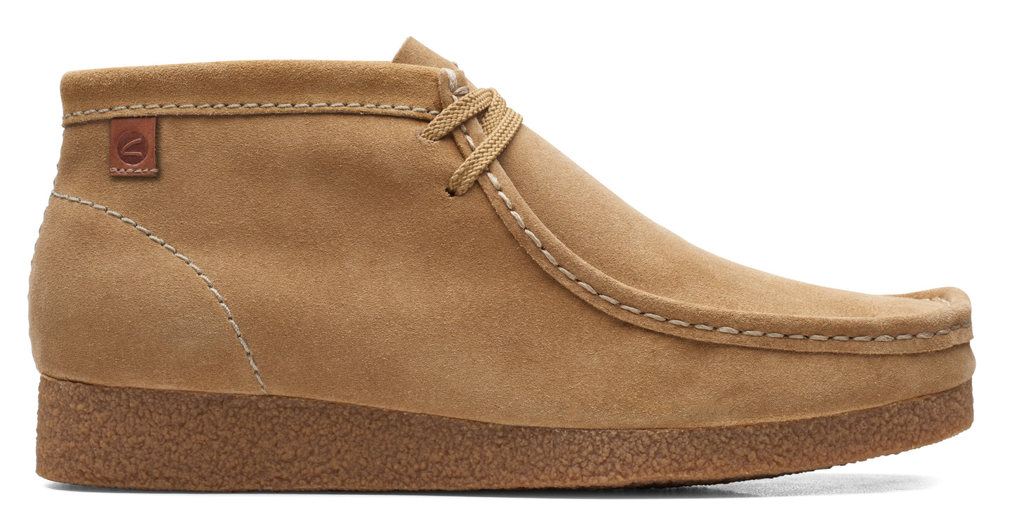 Tan suede chukka boot with crepe sole and laced closure.