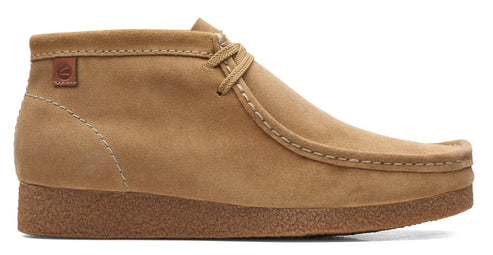 Tan suede chukka boot with crepe sole and laced closure.