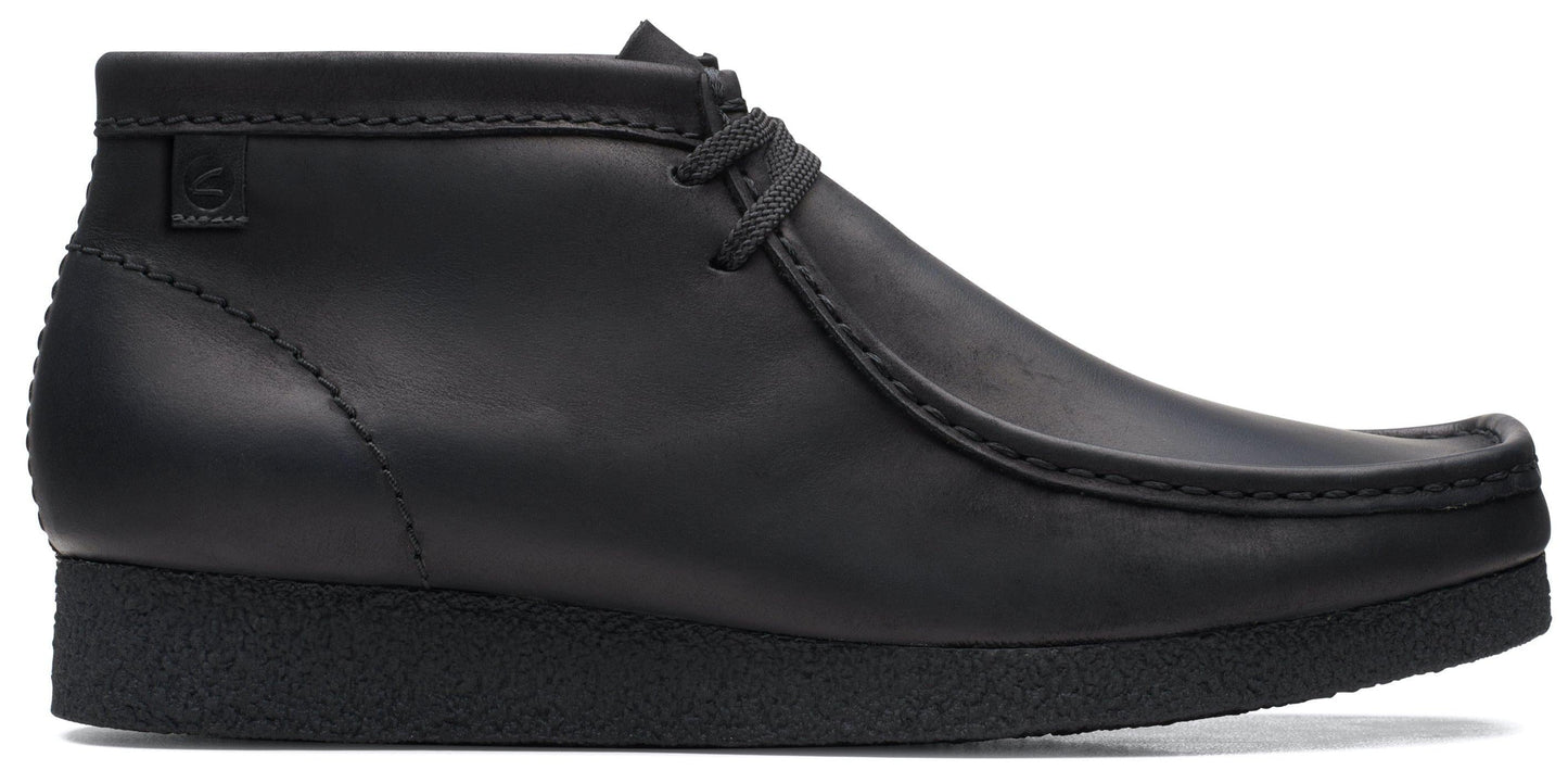 Black leather chukka boot with a crepe sole and a moc toe.