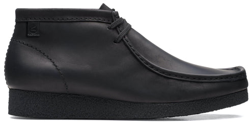 Black leather chukka boot with a crepe sole and a moc toe.
