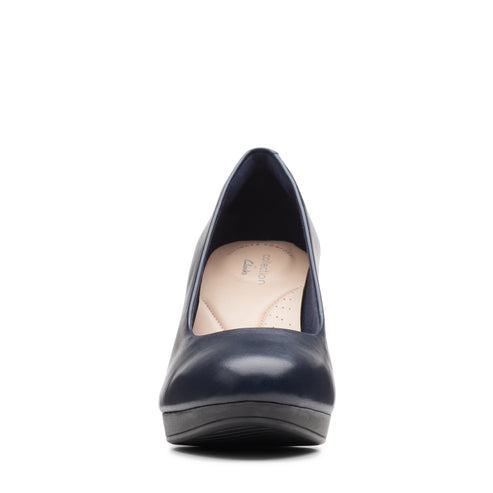 Navy blue rounded toe leather platform pump.
