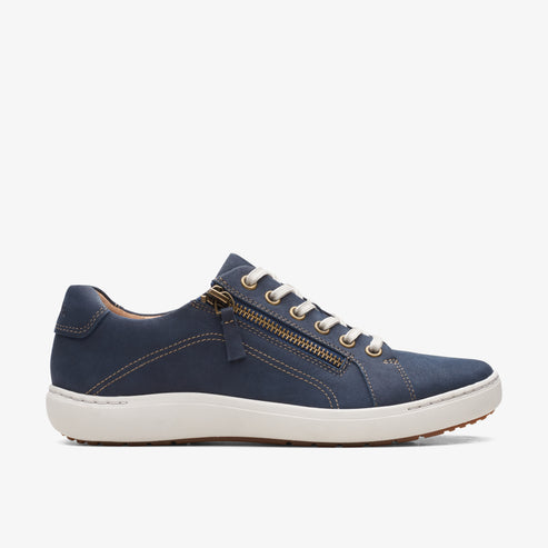 Low-top, navy shoe with white laces, white midsole, and side zipper.