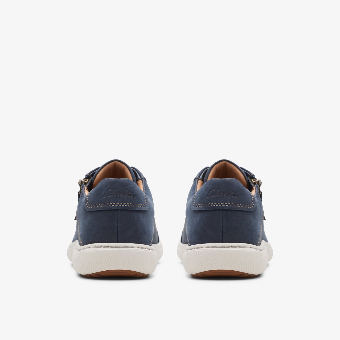 Pair of navy blue low-top sneakers, back view.