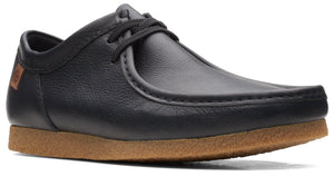 Black leather dress shoe with rounded toe and brown sole.