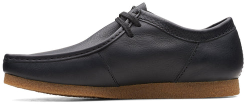 A black leather lace-up dress shoe with a brown sole.